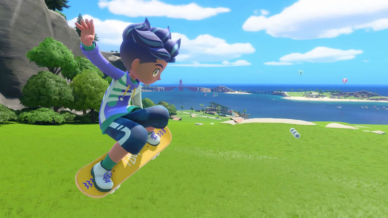 Sportsmate skateboarding across Wuhu Island with the resort coastline in the background